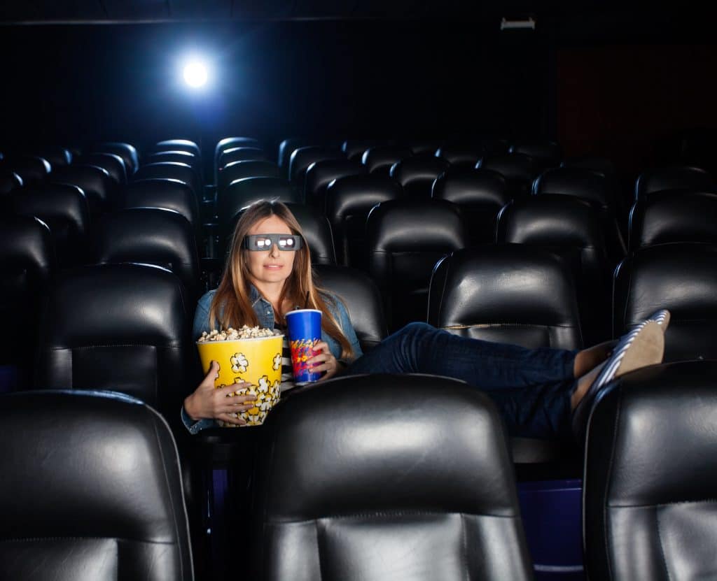 Woman With Feet up Watching Movie