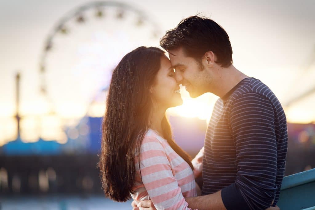 Romantic Couple In Front Of Santa Monica Pier